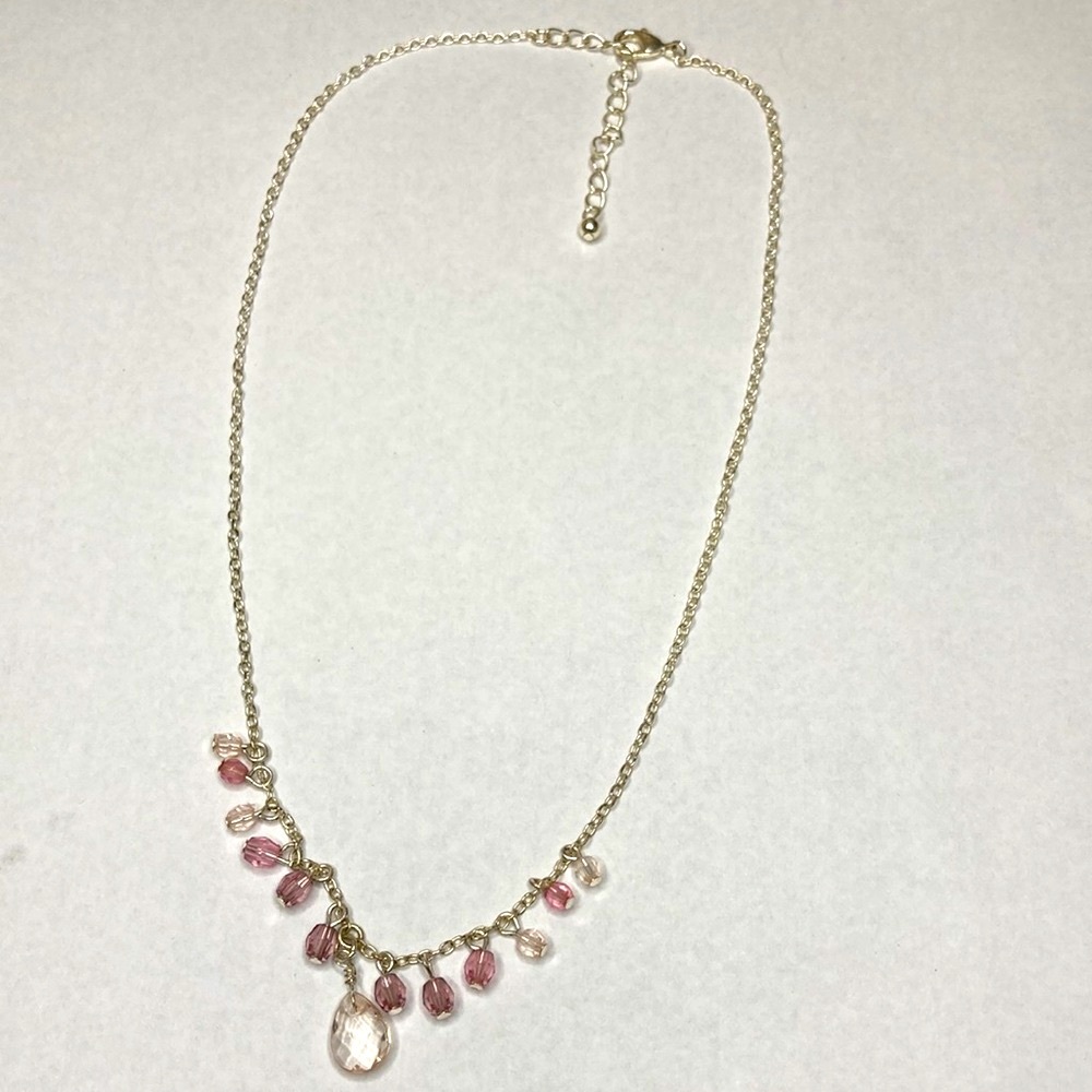 Silver toned necklace with pink stones
